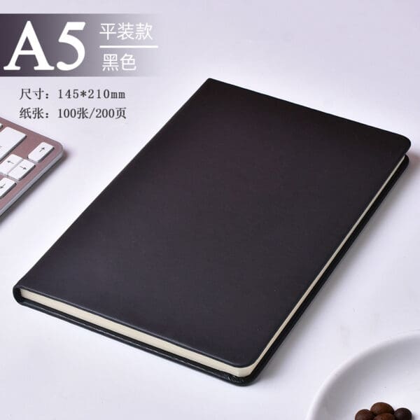 Sleek black A5 notebook ideal for corporate gifts, blending elegance with functionality in a stylish workspace.