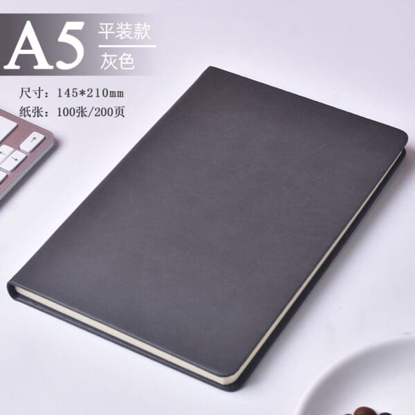 Elegant A5 notebook in black faux leather, perfect for corporate gifts and professional settings.