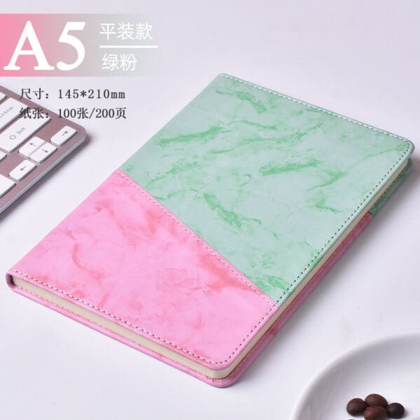 Stylish A5 notebook in green and pink marble, perfect for corporate gifts and professional use.