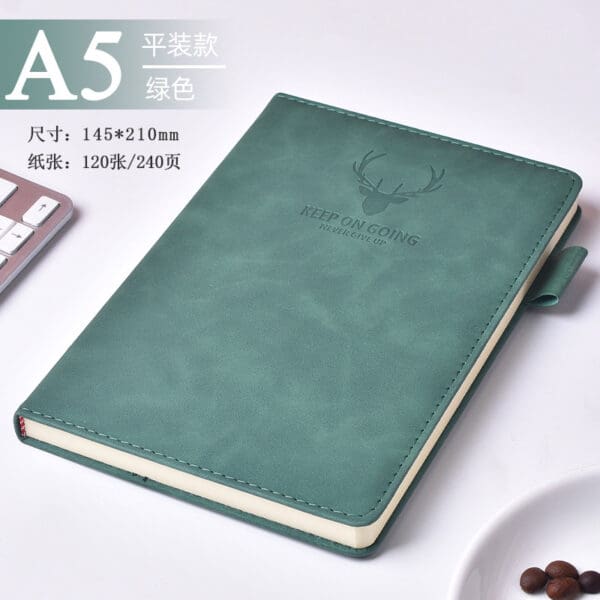 Elegant teal faux leather A5 notebook with embossed antlers, perfect for corporate gifts.