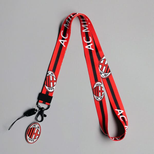 Stylish AC Milan lanyard in red and black, perfect for fans and practical use.