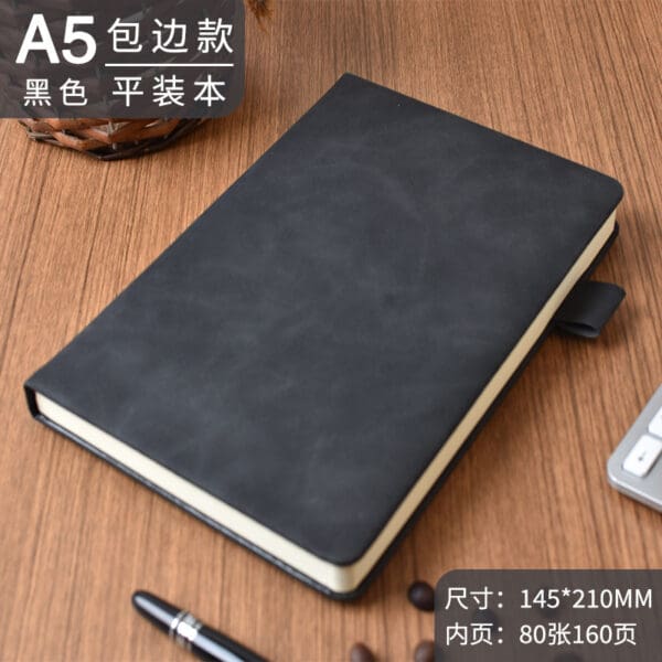 Sleek black A5 notebook on wood, ideal for corporate gifts, blending elegance and functionality.