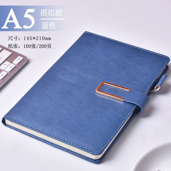 Sleek blue A5 notebook with gold clasp, ideal for corporate gifts and professional settings.