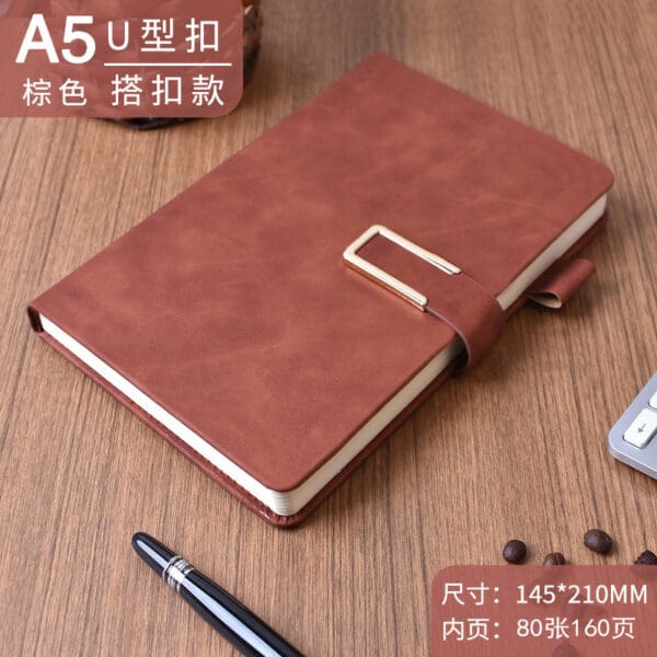 Elegant A5 brown faux leather notebook with gold clasp, perfect for corporate gifts and note-taking.