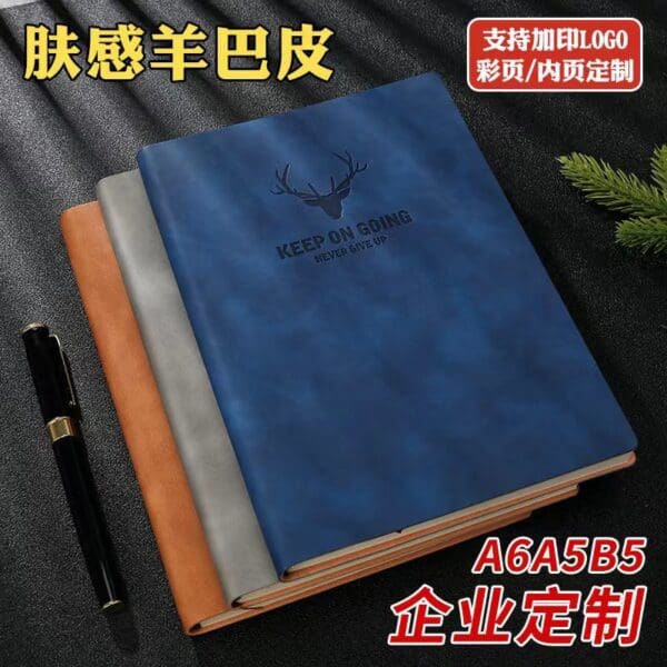 Elegant customizable notebooks in blue, orange, and gray, perfect for corporate gifts and professionals.
