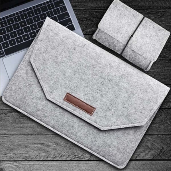 Stylish grey felt laptop sleeve and pouch set, perfect for modern corporate gifts.