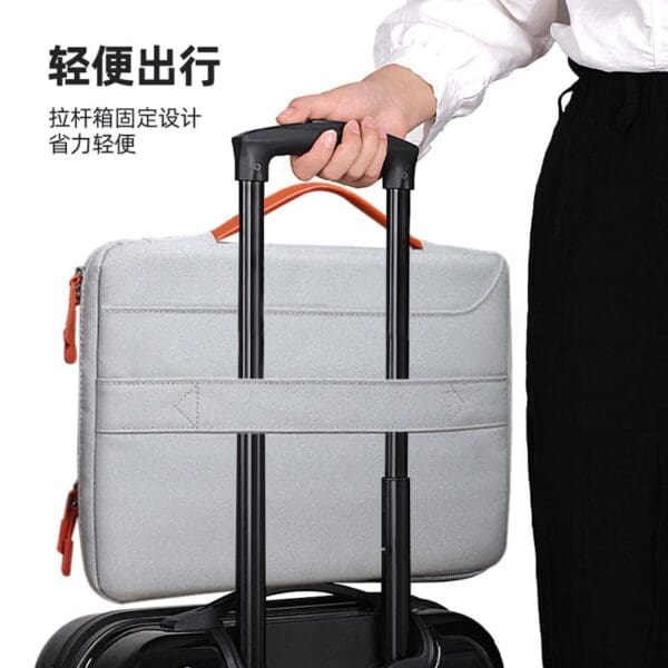 Sleek gray laptop bag and black suitcase: stylish lightweight travel gear for modern professionals.