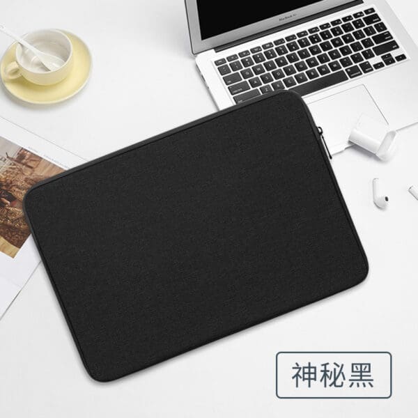Sleek black laptop sleeve on a modern workspace, perfect for stylish corporate gifts.