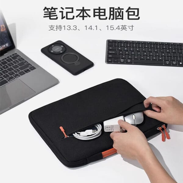 Modern black laptop sleeve with orange accents, perfect for corporate gifts and tech organization.