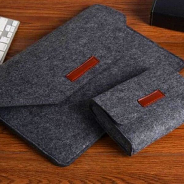 Elegant gray felt laptop sleeve and pouch set, perfect for stylish tech organization and corporate gifting.