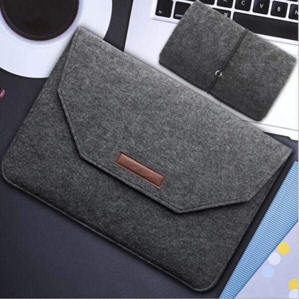 Stylish dark gray felt laptop sleeve with matching accessory case for modern professionals.