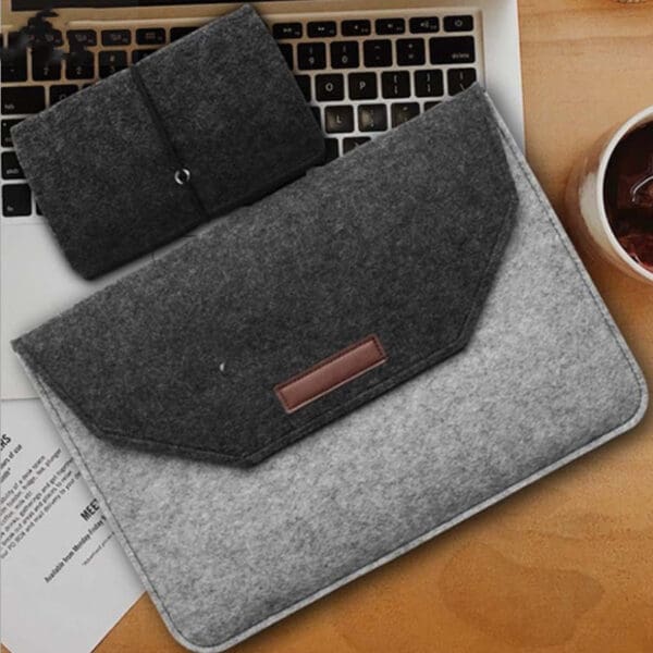 Stylish gray felt laptop sleeve and pouch, perfect for corporate gifts and organization.