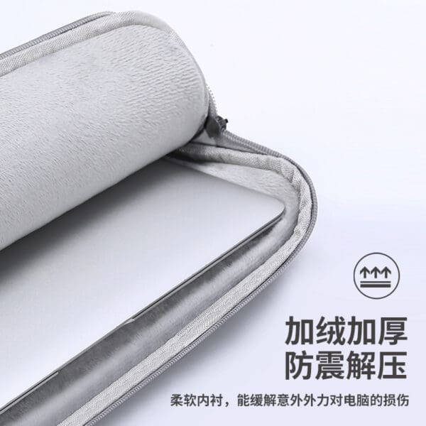 Stylish gray laptop sleeve with plush padding, perfect for corporate gifts and on-the-go professionals.