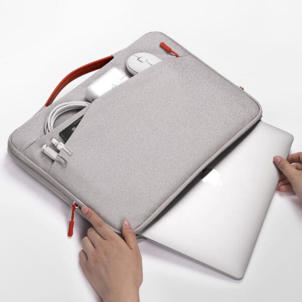 Sleek gray laptop sleeve with organized accessories, perfect for corporate gifts and modern professionals.