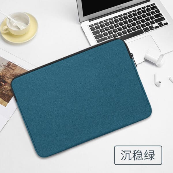 Stylish teal laptop sleeve on a desk, perfect for professionals seeking modern elegance.