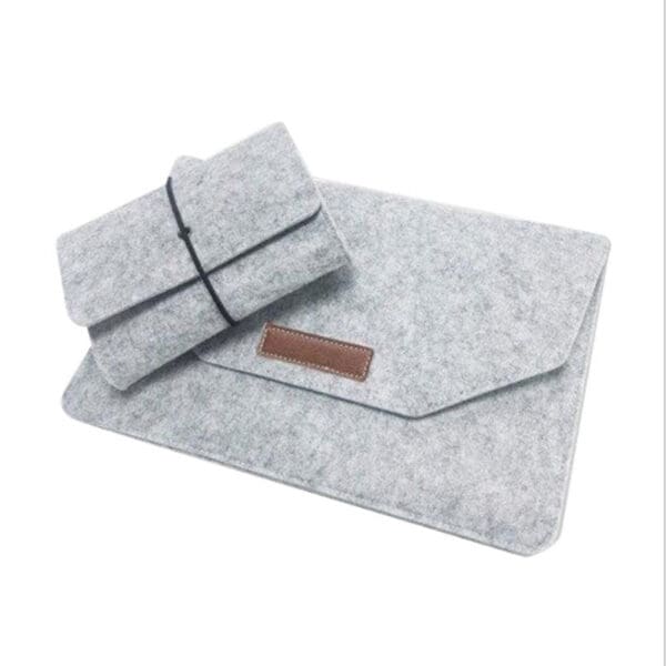 Sleek gray felt laptop sleeve and pouch set, perfect minimalist accessories for corporate gifting.
