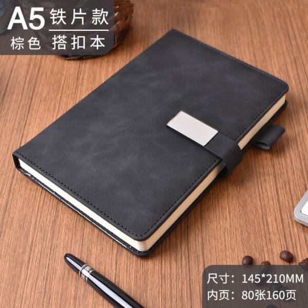 Sleek A5 black faux leather notebook with silver clasp, perfect for corporate gifts and stylish organization.