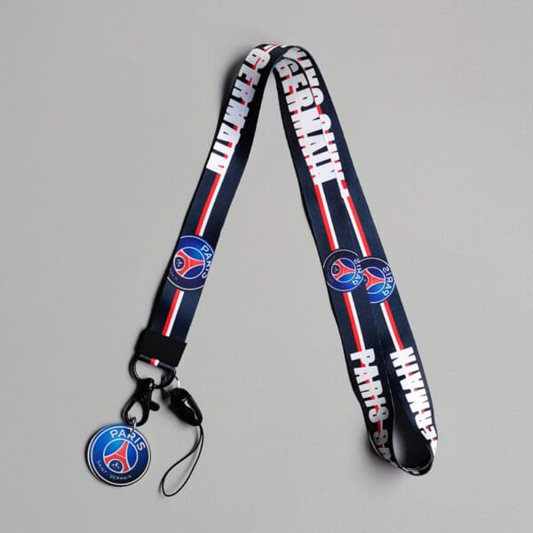 Paris Saint-Germain lanyard in navy, red, and white with PSG logo; perfect for fans.