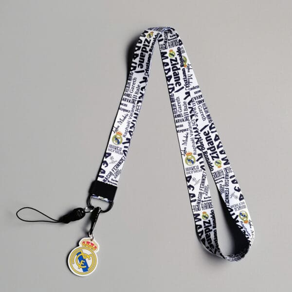 Stylish Real Madrid lanyard with logo charm, perfect corporate gift for passionate fans.