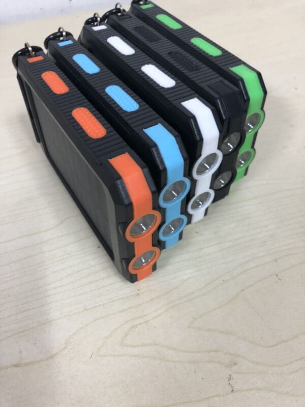 Rugged portable devices with vibrant accents, ideal corporate gifts for tech-savvy professionals.