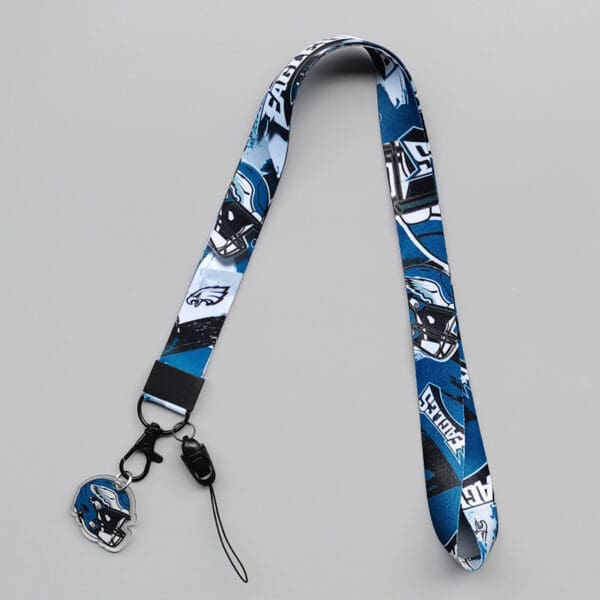 Vibrant blue and black sports lanyard with helmet graphics, perfect for fans and corporate gifts.