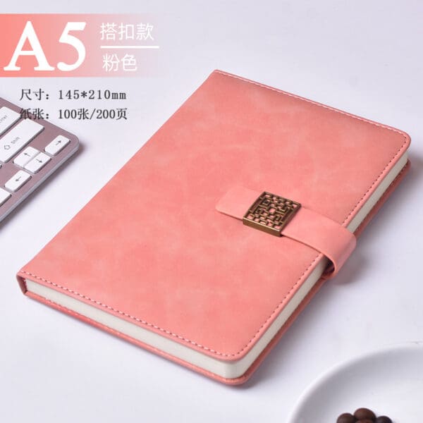 Elegant pink A5 notebook with faux leather cover, perfect for corporate gifts and creative minds.