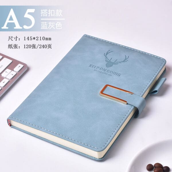 Elegant sky blue A5 notebook with copper clip, perfect for corporate gifts and professional use.